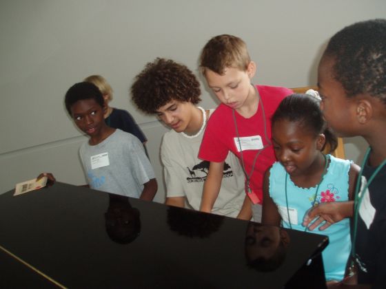 Jayce teaches piano
Jayce playing the piano with the VBS kids
