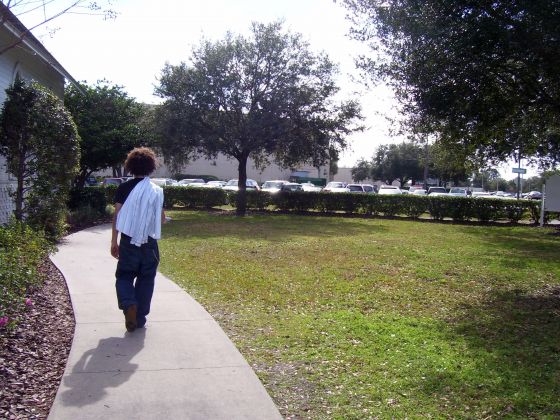 Jayce walking down the sidewalk
