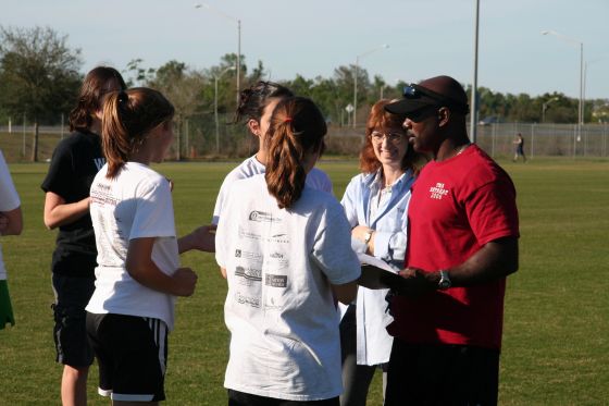 Track meeting
Coach and my mother talking to the girls of the track team before a practice
