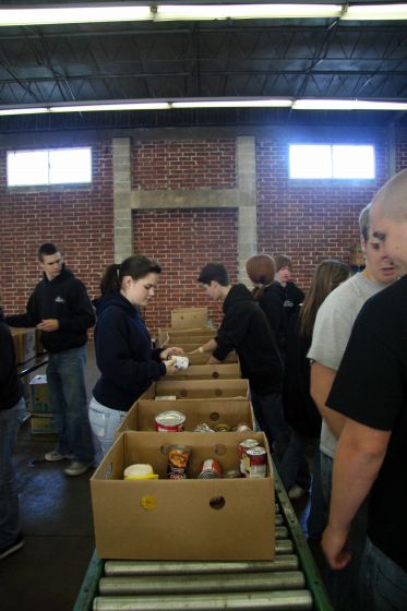 Food packaging line
Brett, Kaleigh, David, Joanna, Janssen, and Ray working in the food boxing line at the Second Harvest Food Bank
