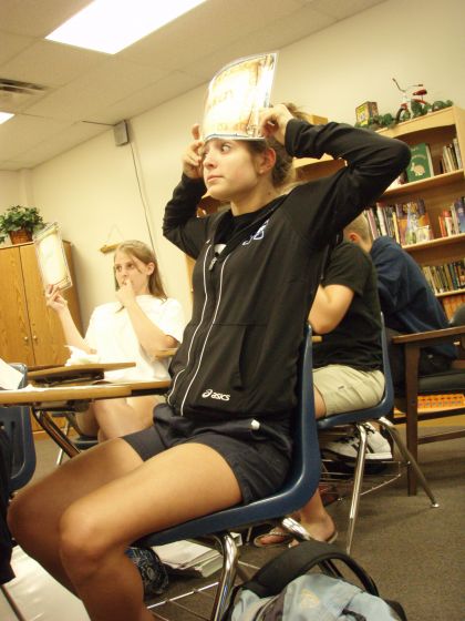 Ashlyn has the answer
Ashlyn holding up her answer drawing during an English class review game
