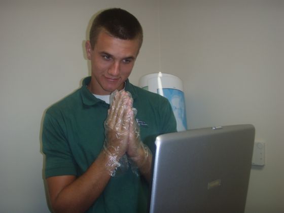 Brett hmm
Brett with his gloves on checking grades on Mr. Darnell's laptop (ok not really)
