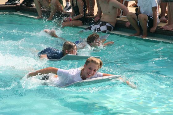 Panel boats race 2
Chloe and Hazel racing on the cardboard boats at retreat
