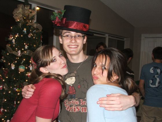 Sean, the other pimp
Ladies man Sean poses with Amanda and Amy at the Junior class Christmas party
