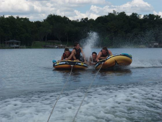 Kyle dragging
Jeff, Brett, and Brooks trying to keep Kyle from falling off completely from the tube as he's dragged along
