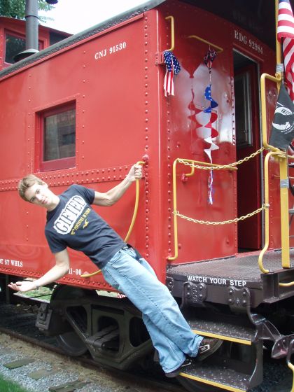 Lancaster caboose
Me hanging off of one of the train cars that were converted into a museum
